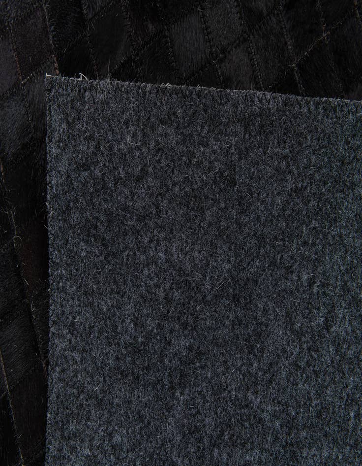 Detail image of 5' x 7' 11 Cowhide Stocks Rug