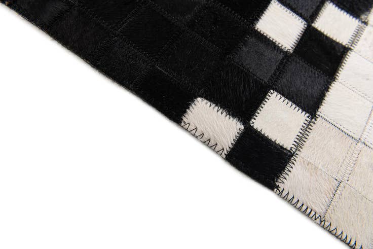 Detail image of 5' 1 x 8' 1 Cowhide Stocks Rug