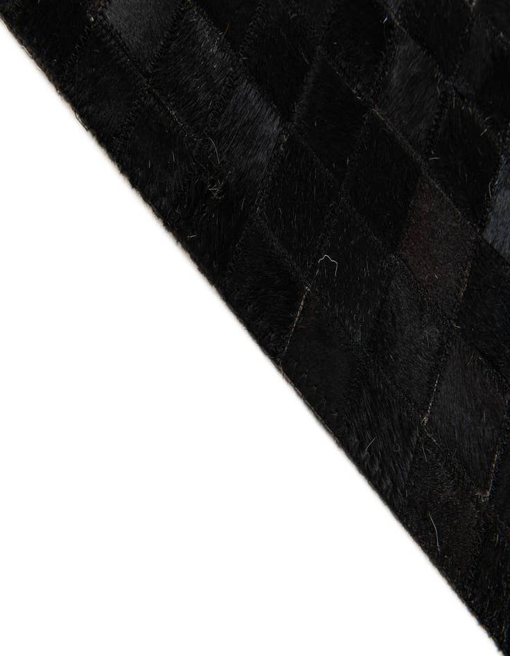 Detail image of 5' x 7' 11 Cowhide Stocks Rug