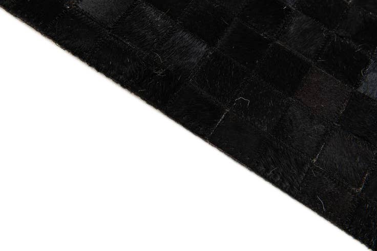 Detail image of 5' x 7' 11 Cowhide Stocks Rug