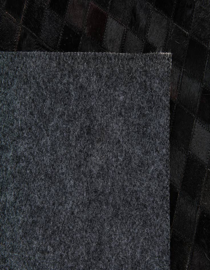 Detail image of 5' x 7' 11 Cowhide Stocks Rug