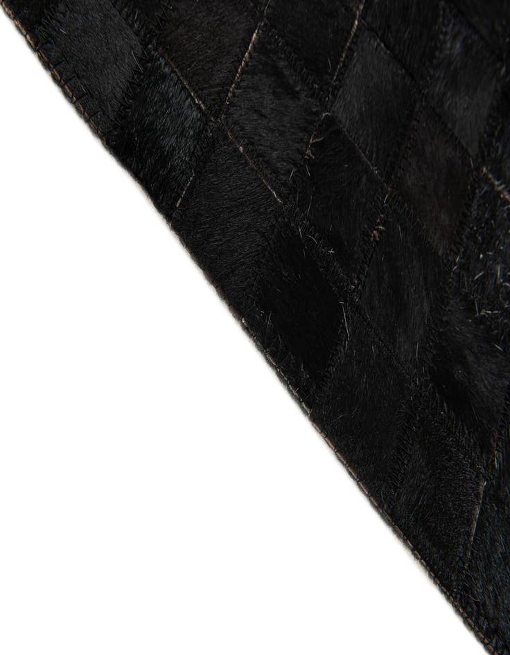 Detail image of 5' x 7' 11 Cowhide Stocks Rug