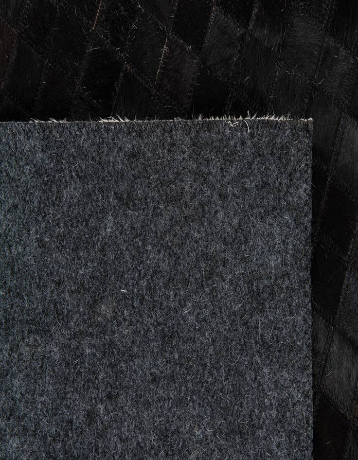 Detail image of 5' x 7' 11 Cowhide Stocks Rug