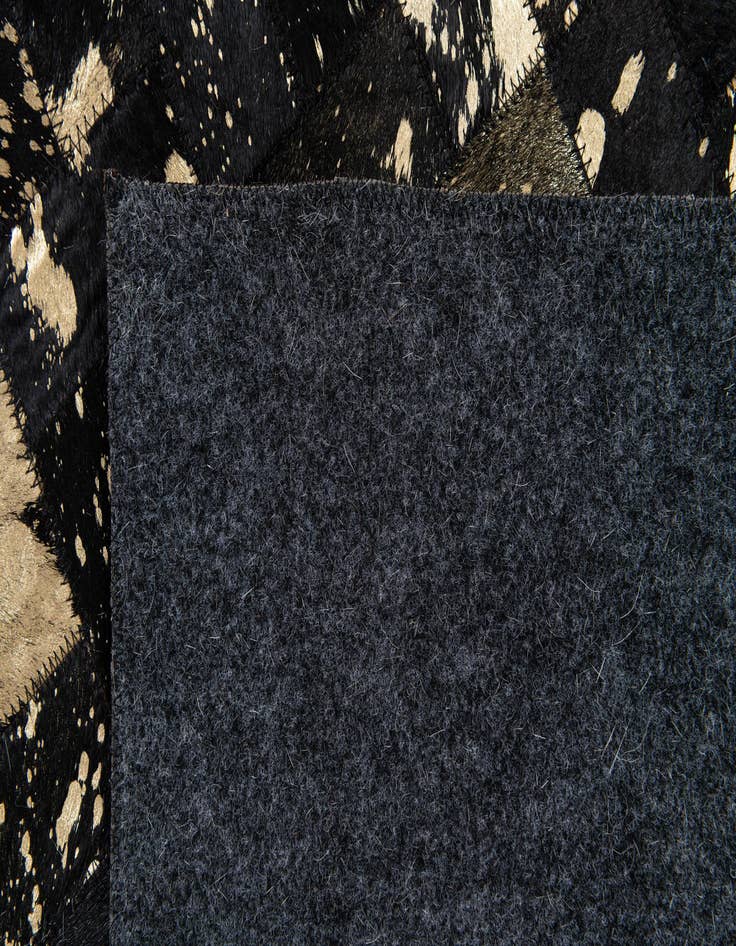 Detail image of 5' x 7' 11 Cowhide Stocks Rug