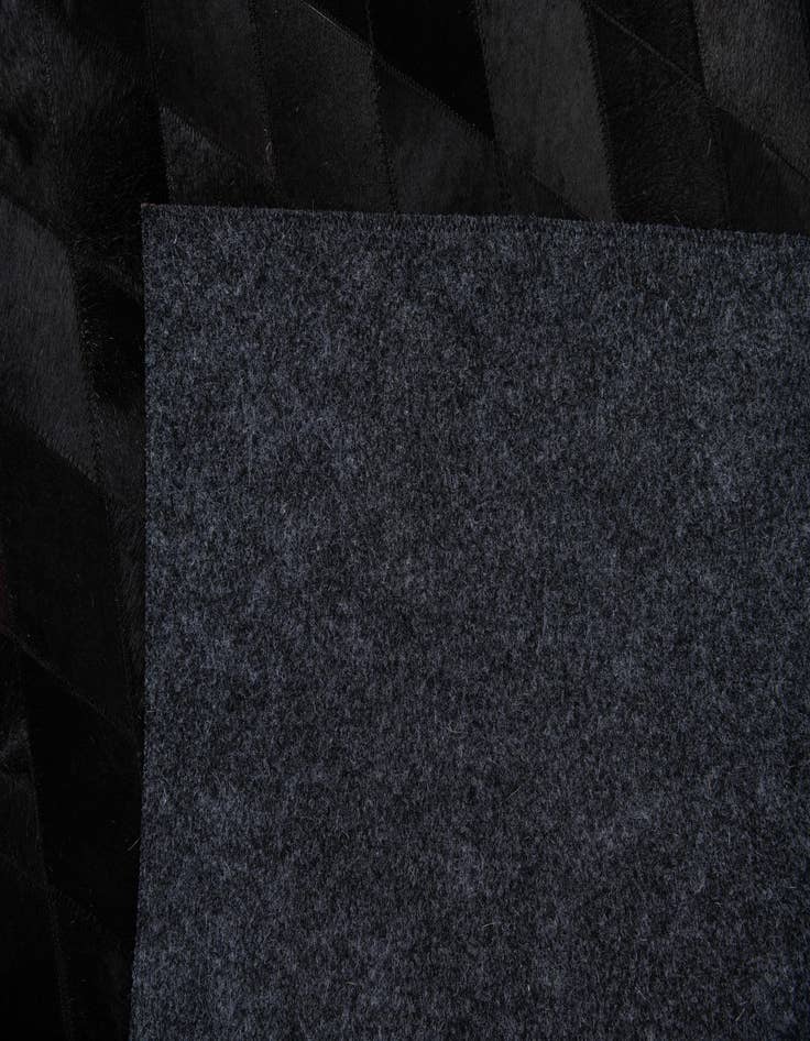 Detail image of 4' 7 x 6' 5 Cowhide Stocks Rug