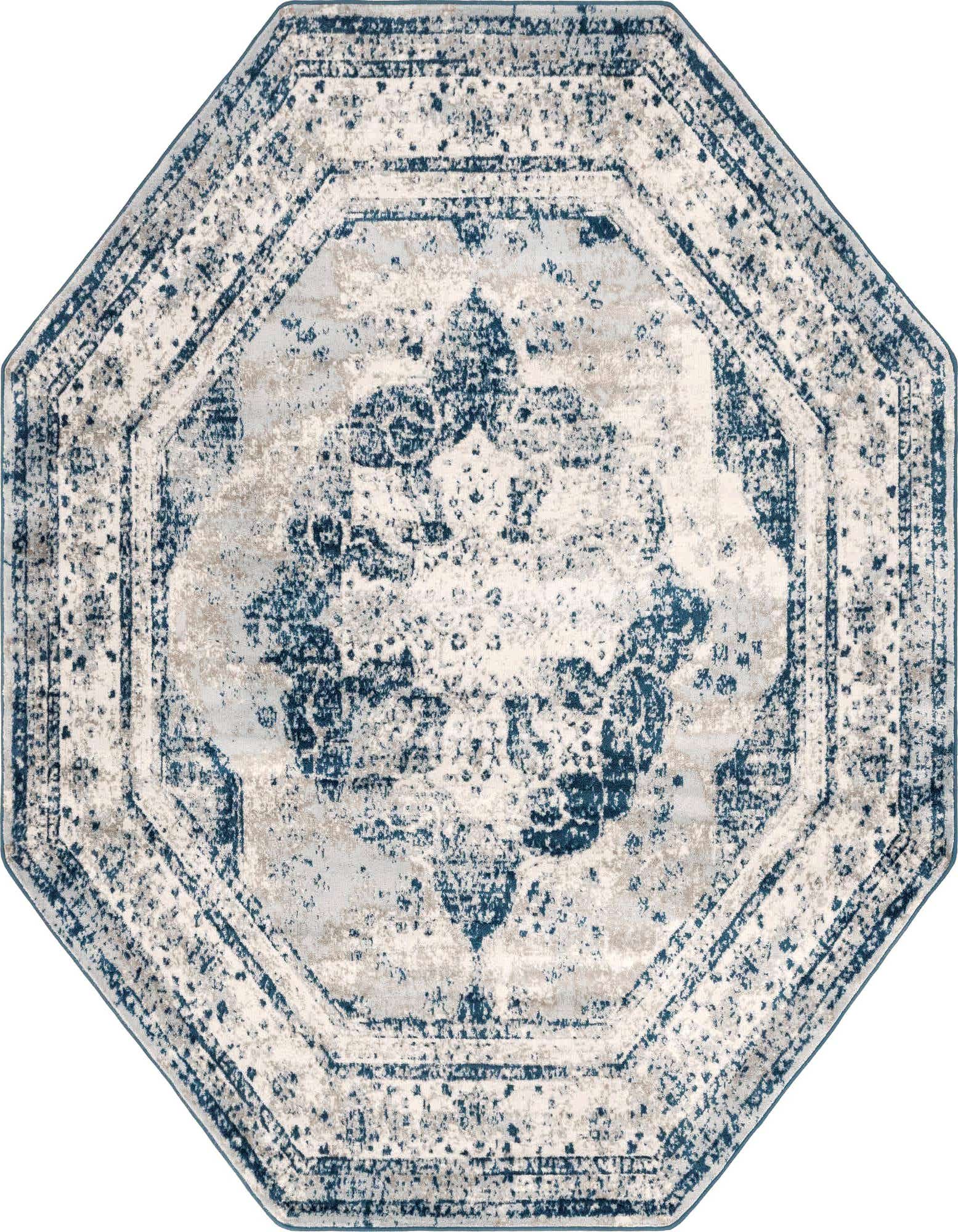 An octagon-shaped Monte Carlo rug featuring a distressed blue and white medallion pattern with traditional and bohemian influences.