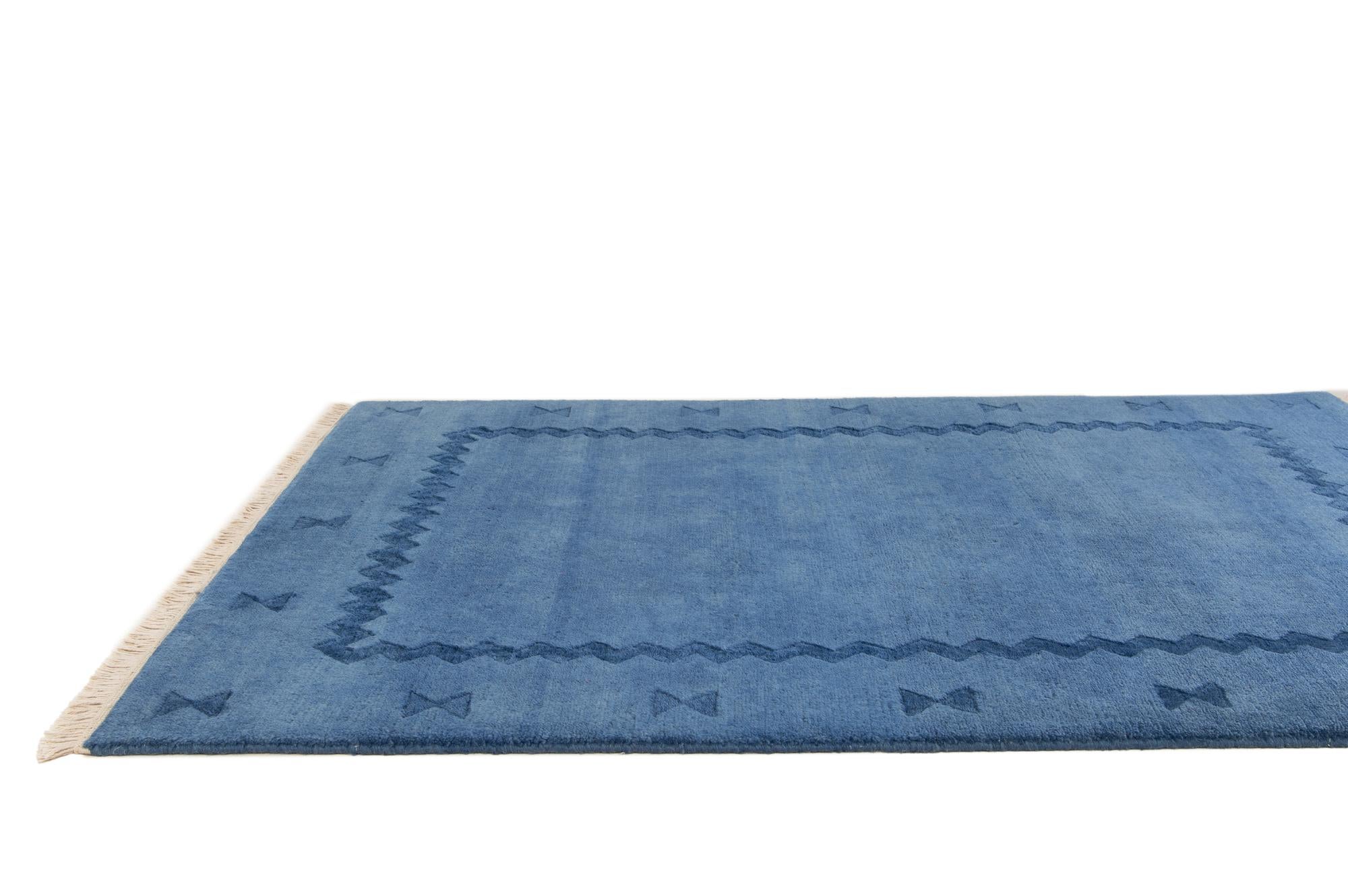 3' 11 x 5' 4 Hand Knotted Tibet Wool Rug