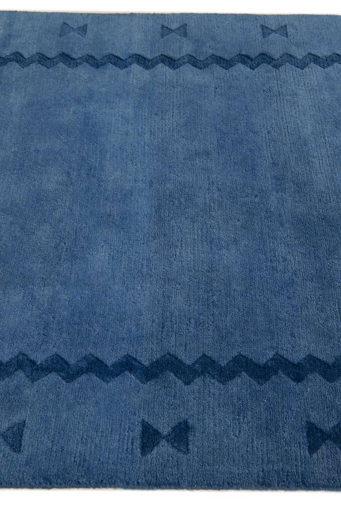 3' 11 x 5' 4 Hand Knotted Tibet Wool Rug