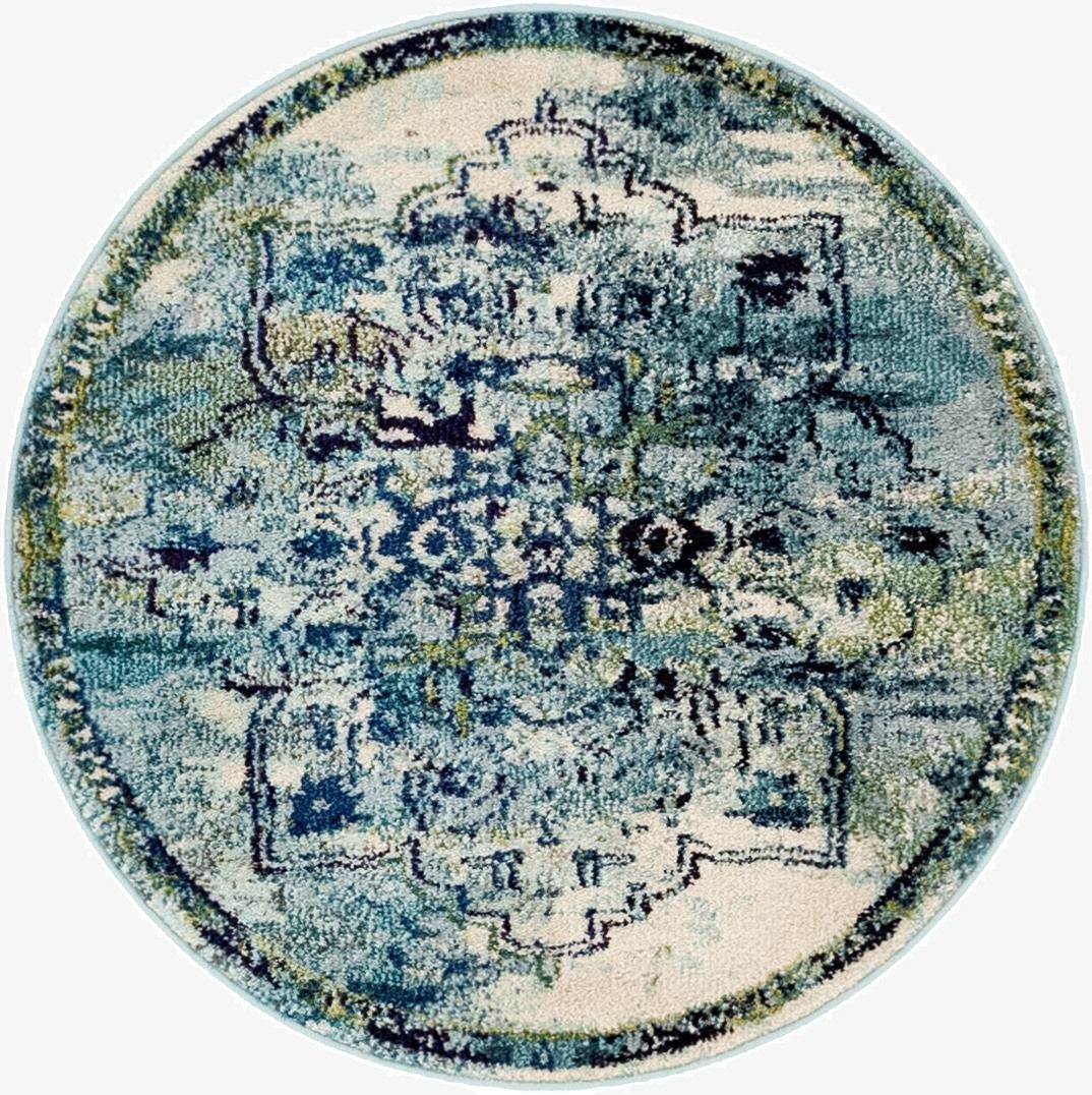A 3' 3 round blue medallion rug with distressed bohemian and traditional patterns, featuring shades of blue, cream, and hints of green.