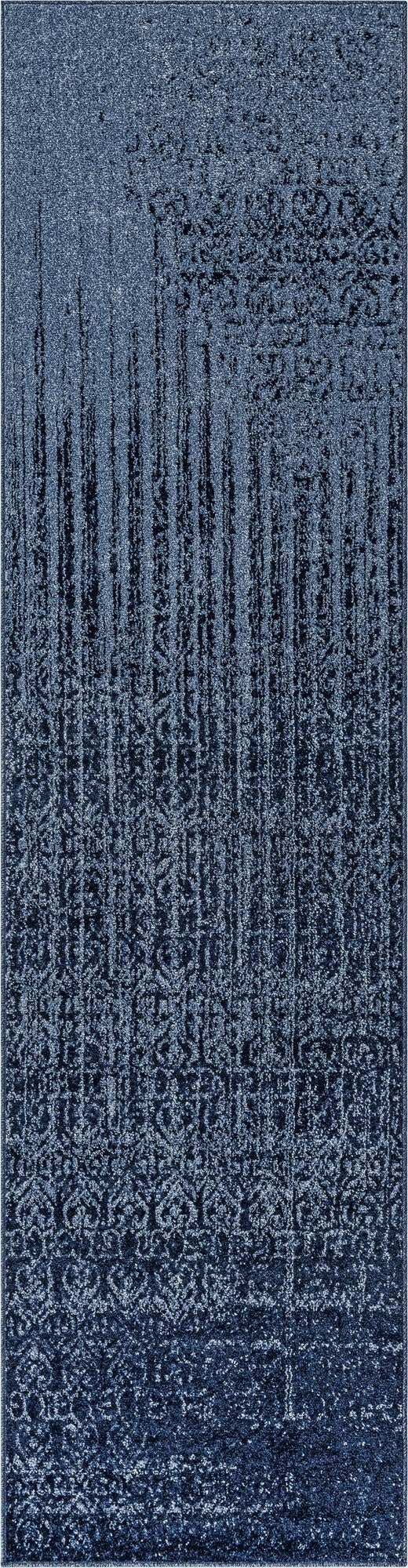 A 10 ft runner rug in varying shades of blue, featuring an abstract, distressed pattern with vertical lines and subtle traditional motifs.