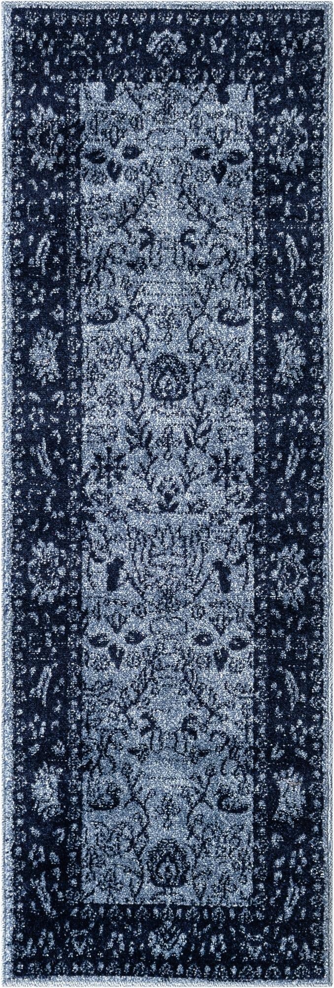 A 6 ft runner rug in varying shades of blue, featuring a distressed traditional floral pattern with a darker border, ideal for a hallway or kitchen.