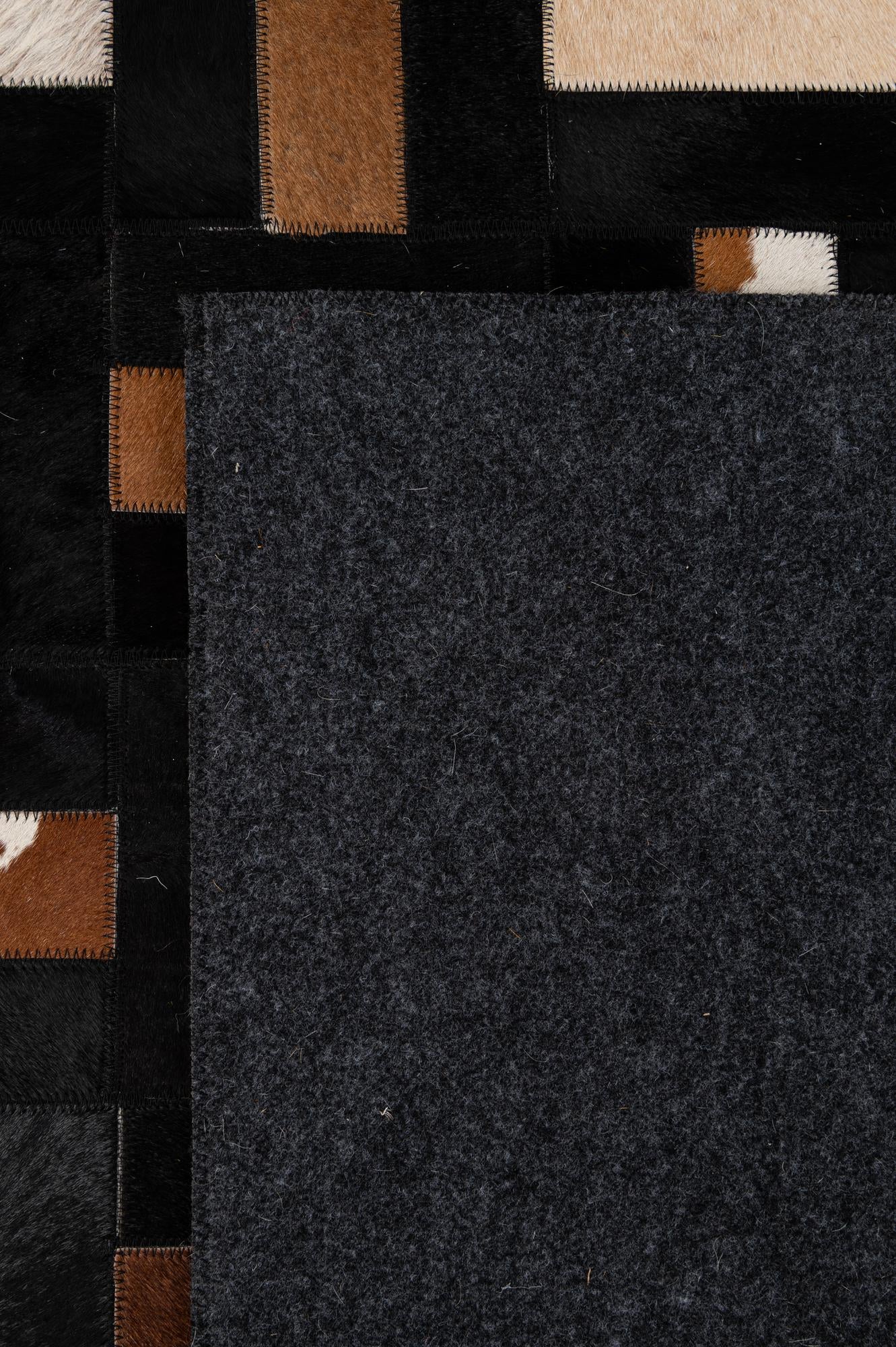 5' 3 x 8' 1 Cowhide - Patchwork Rug