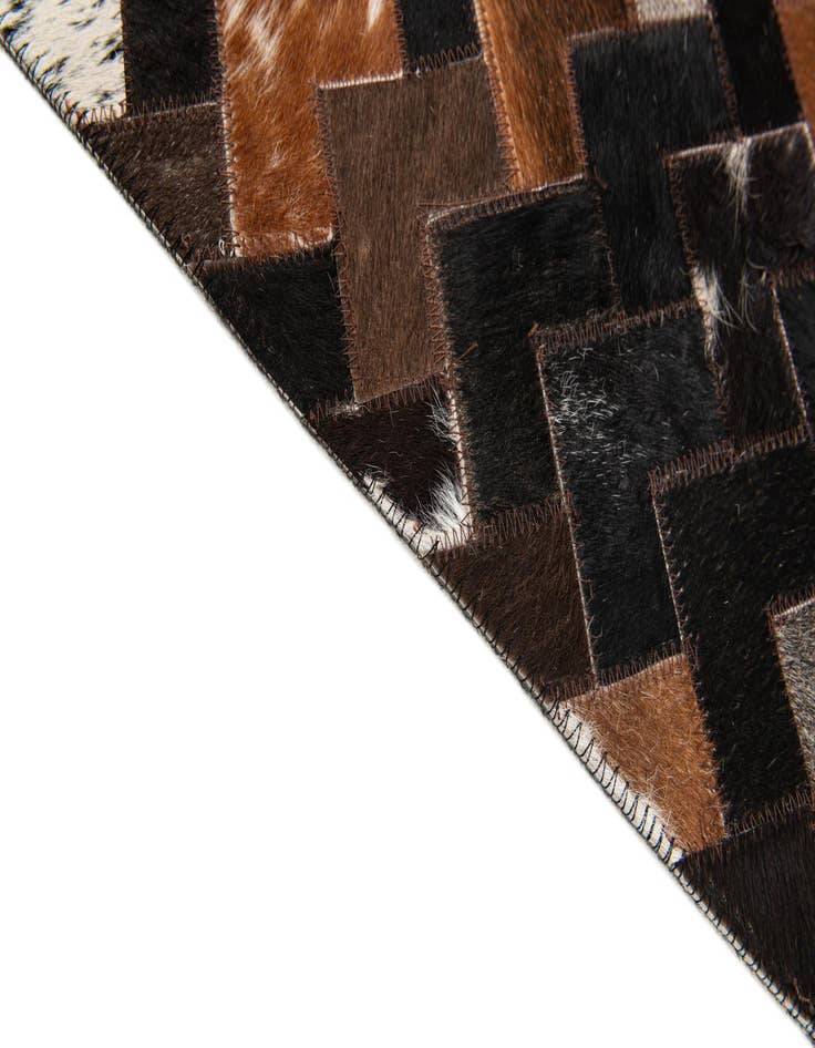 Detail image of 5' x 7' 11 Cowhide Stocks Rug