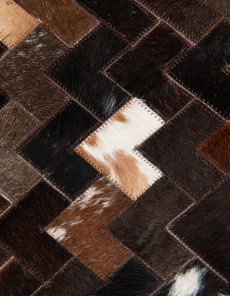 Detail image of 5' x 7' 11 Cowhide Stocks Rug
