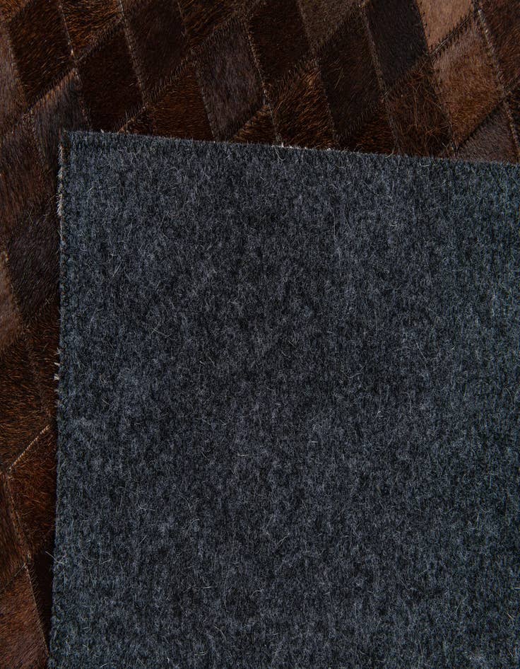 Detail image of 5' x 7' 11 Cowhide Stocks Rug