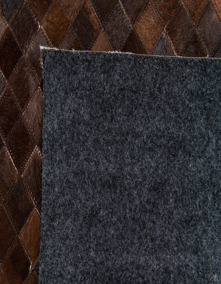 Detail image of 5' x 7' 11 Cowhide Stocks Rug