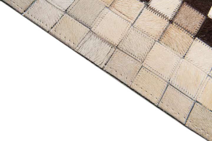 5' 2 x 8' 1 Cowhide Stocks Rug