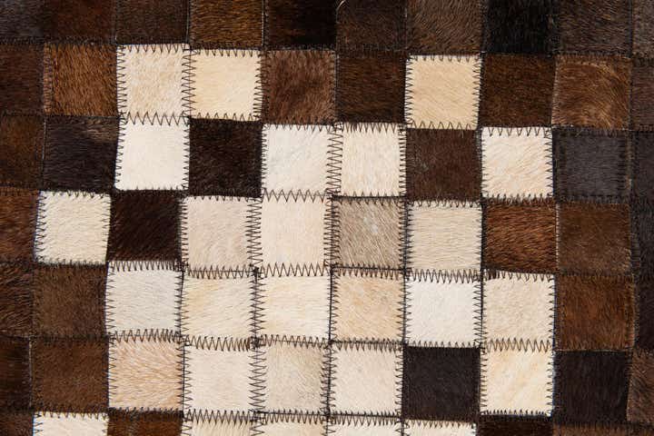 5' 2 x 8' 1 Cowhide Stocks Rug
