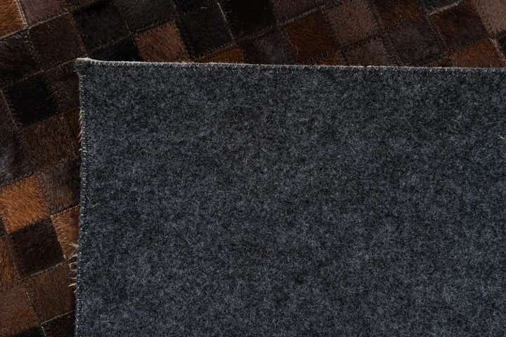 5' 2 x 8' 1 Cowhide Stocks Rug