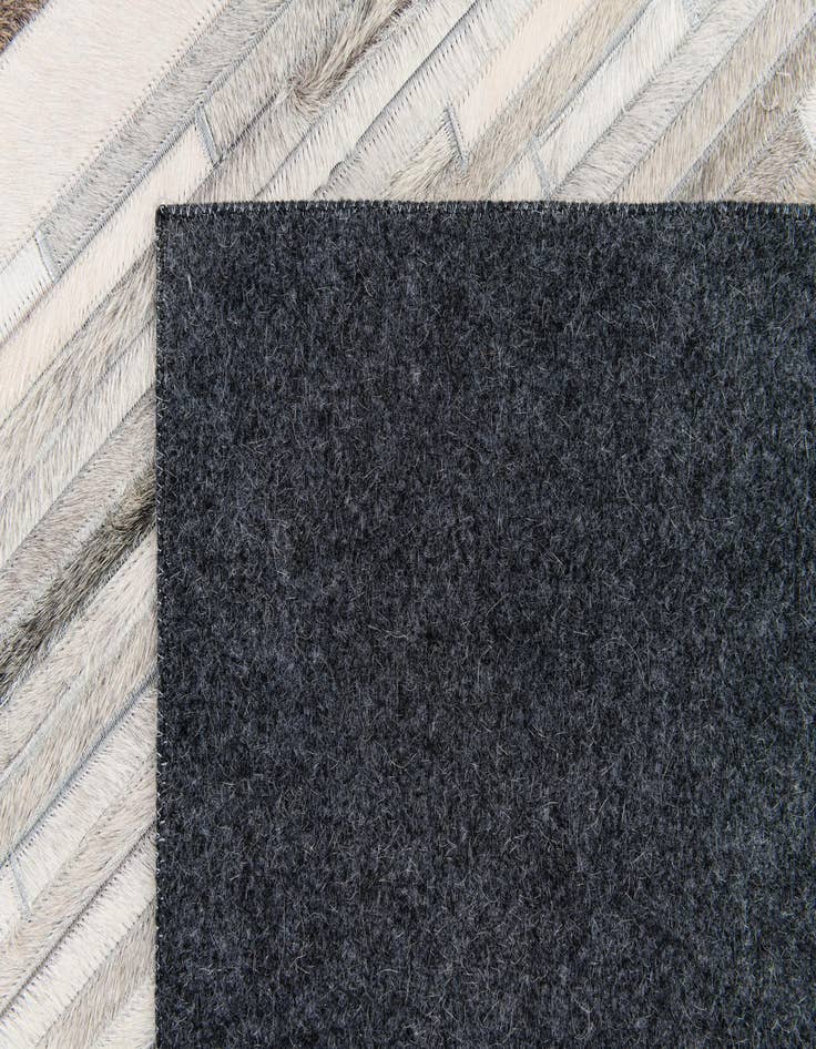 Detail image of 5' 1 x 8' Cowhide Stocks Rug