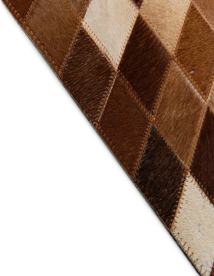 Detail image of 5' x 7' 11 Cowhide Stocks Rug