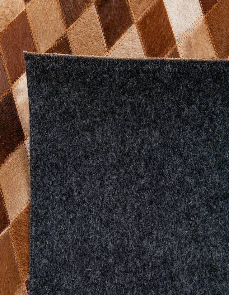 Detail image of 5' x 7' 11 Cowhide Stocks Rug