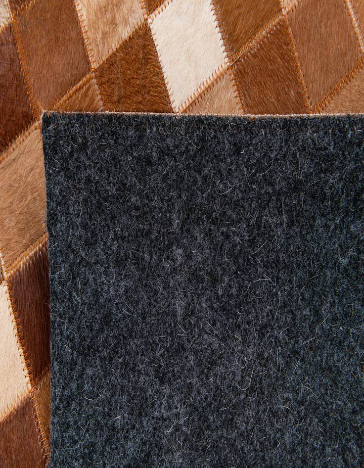 Detail image of 5' 1 x 8' 2 Cowhide Stocks Rug