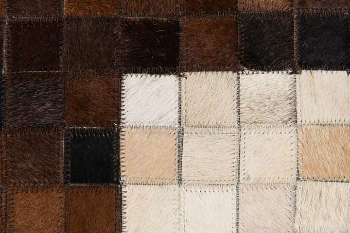 5' 2 x 8' 1 Cowhide Stocks Rug