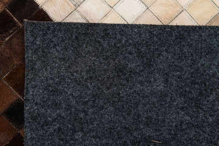 5' 2 x 8' 1 Cowhide Stocks Rug