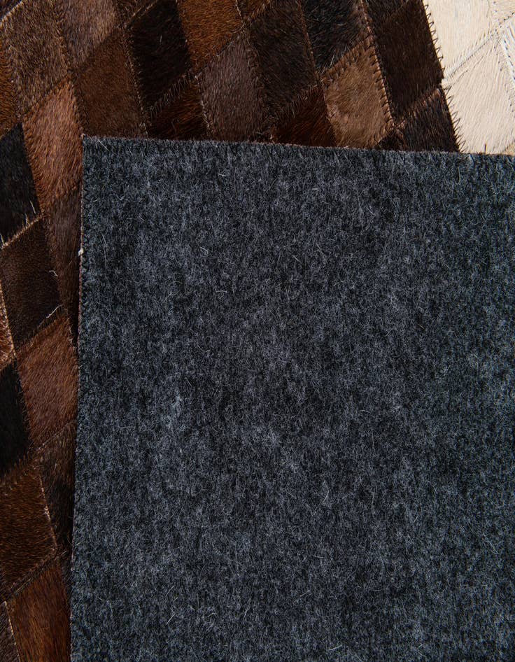Detail image of 5' x 7' 10 Cowhide Stocks Rug