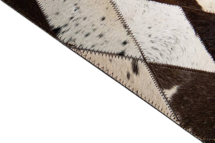 Detail image of 4' 8 x 6' 9 Cowhide Stocks Rug