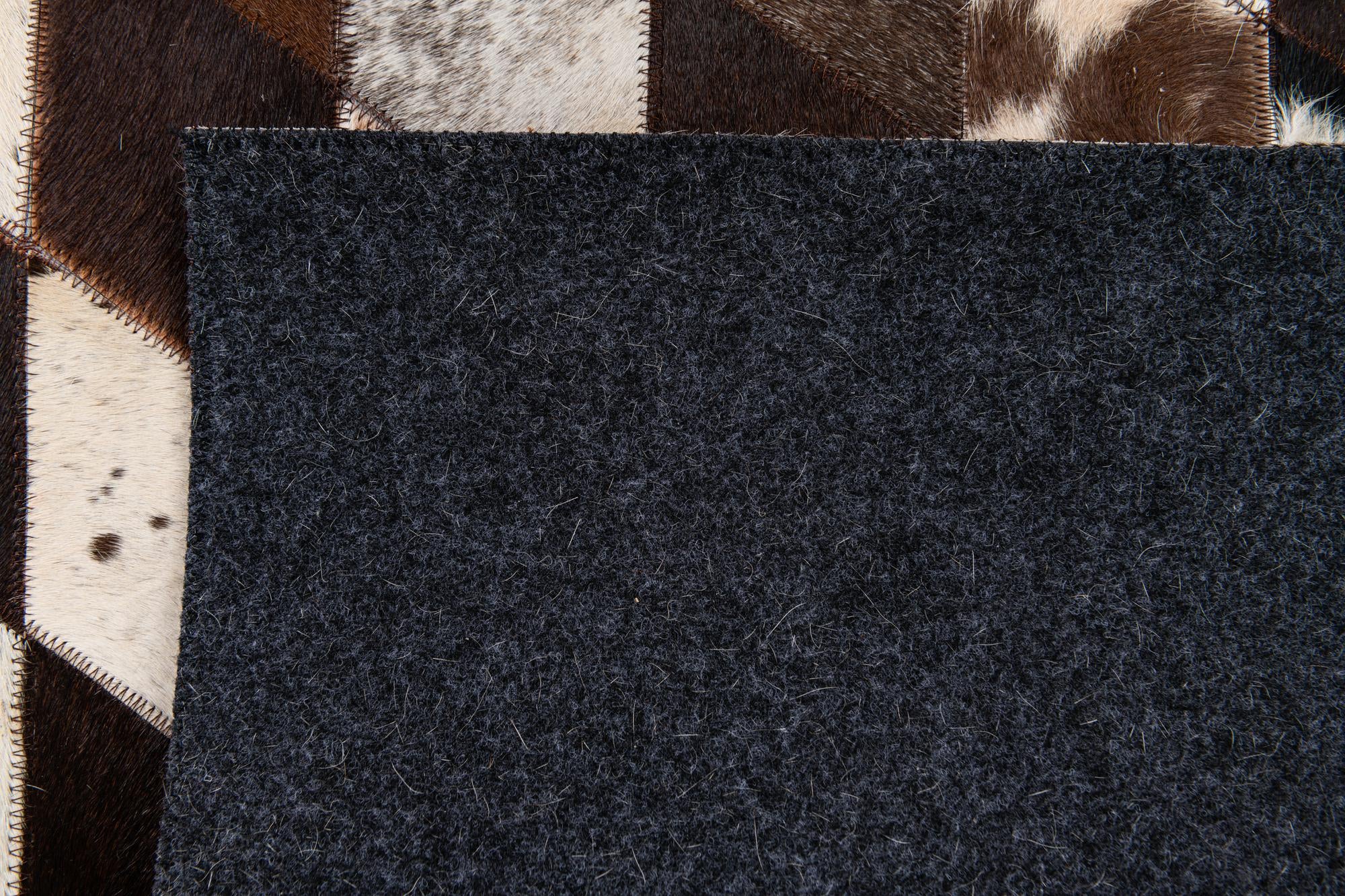 4' 8 x 6' 9 Cowhide Stocks Rug