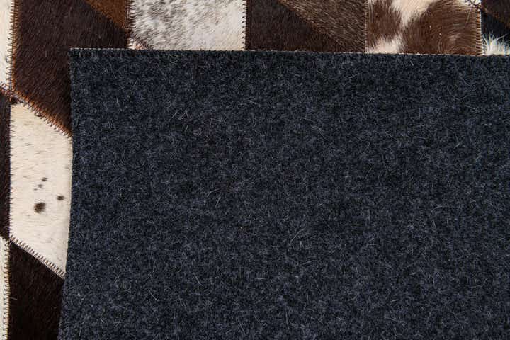 4' 8 x 6' 9 Cowhide Stocks Rug