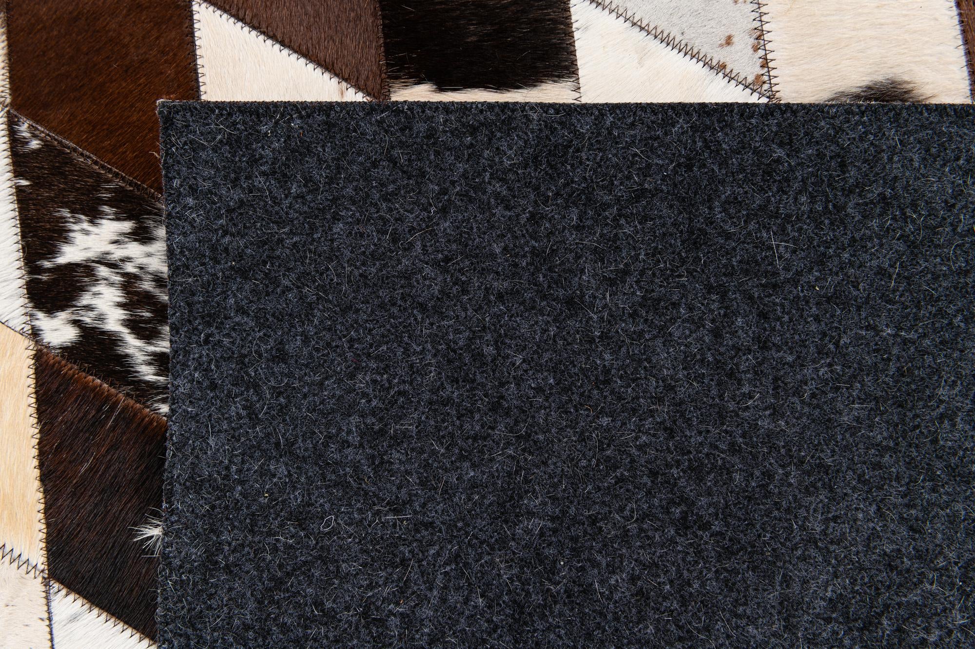 4' 8 x 6' 9 Cowhide Stocks Rug