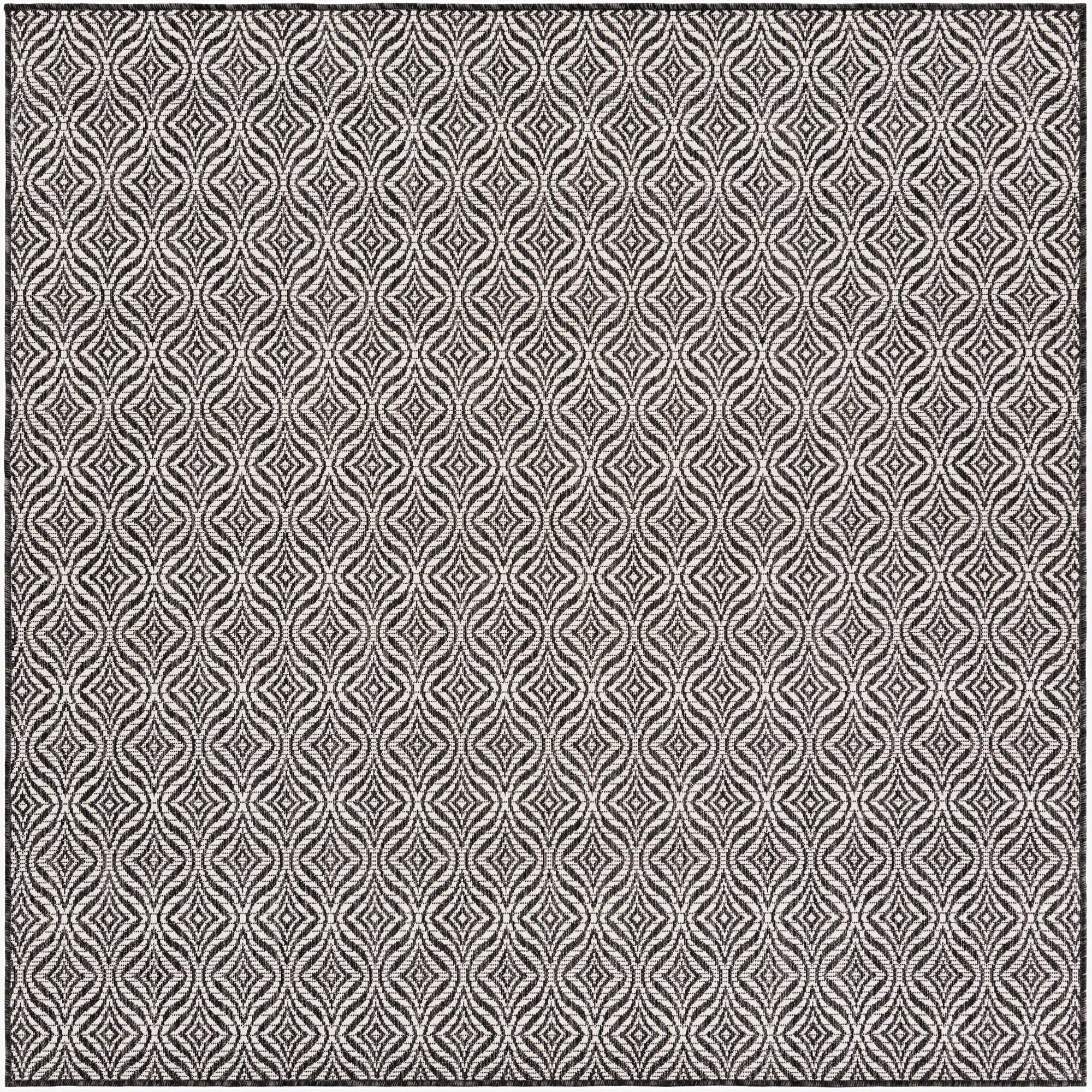A 6'x6' square black and white modern trellis pattern rug, ideal for indoor or outdoor spaces like a patio.