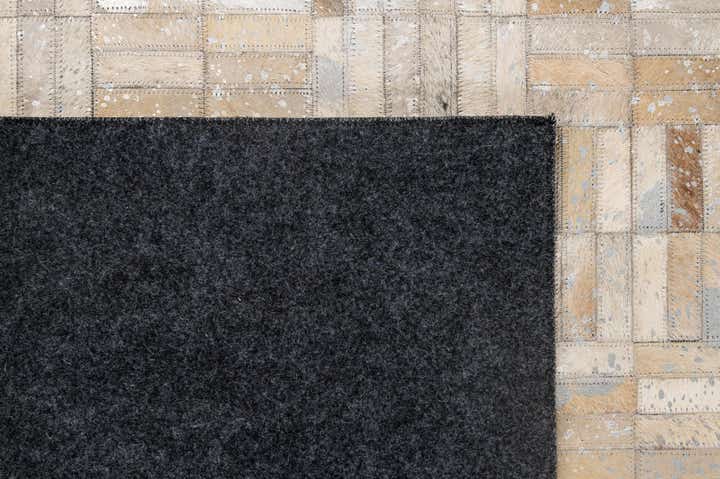 4' 11 x 7' 9 Cowhide - Patchwork Rug