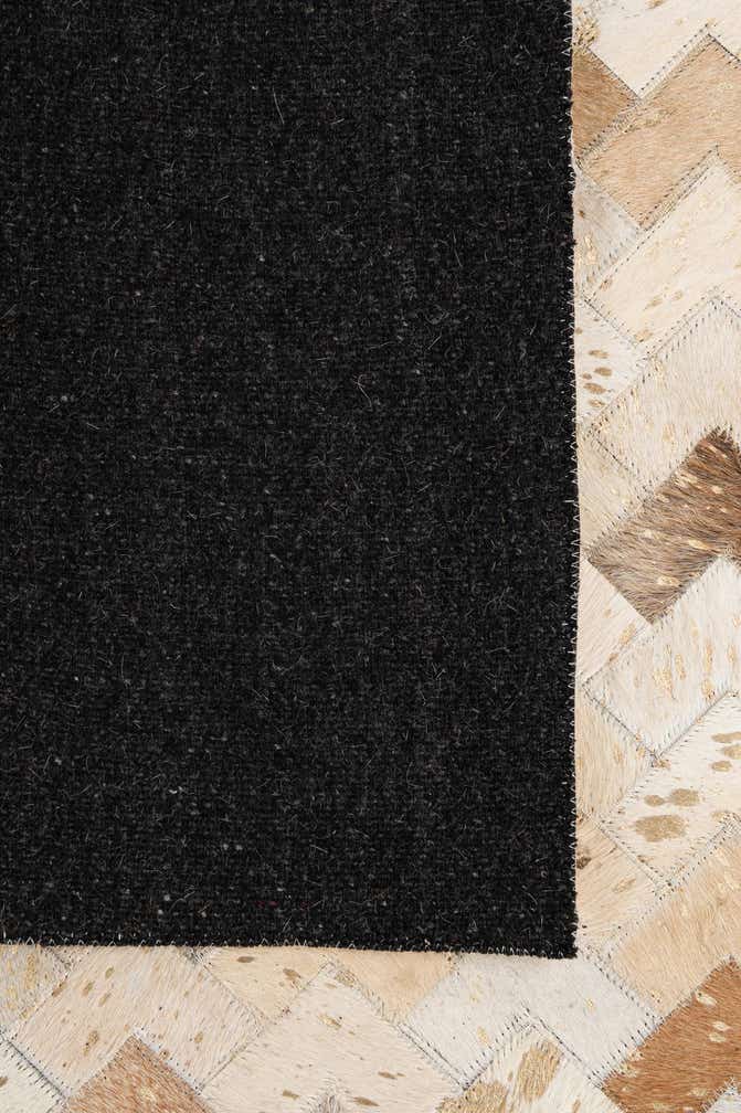 5' 3 x 8' 1 Cowhide - Patchwork Rug