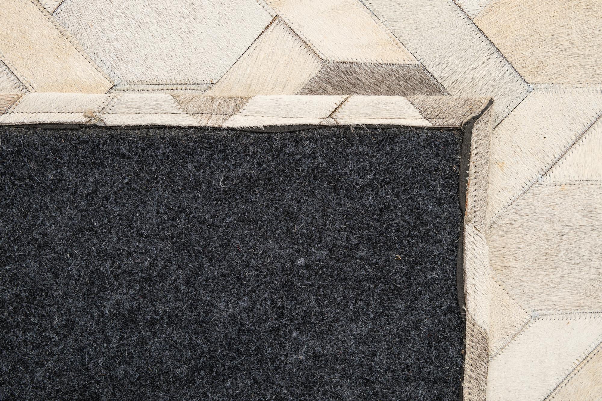 4' 11 x 8' 1 Cowhide - Patchwork Rug