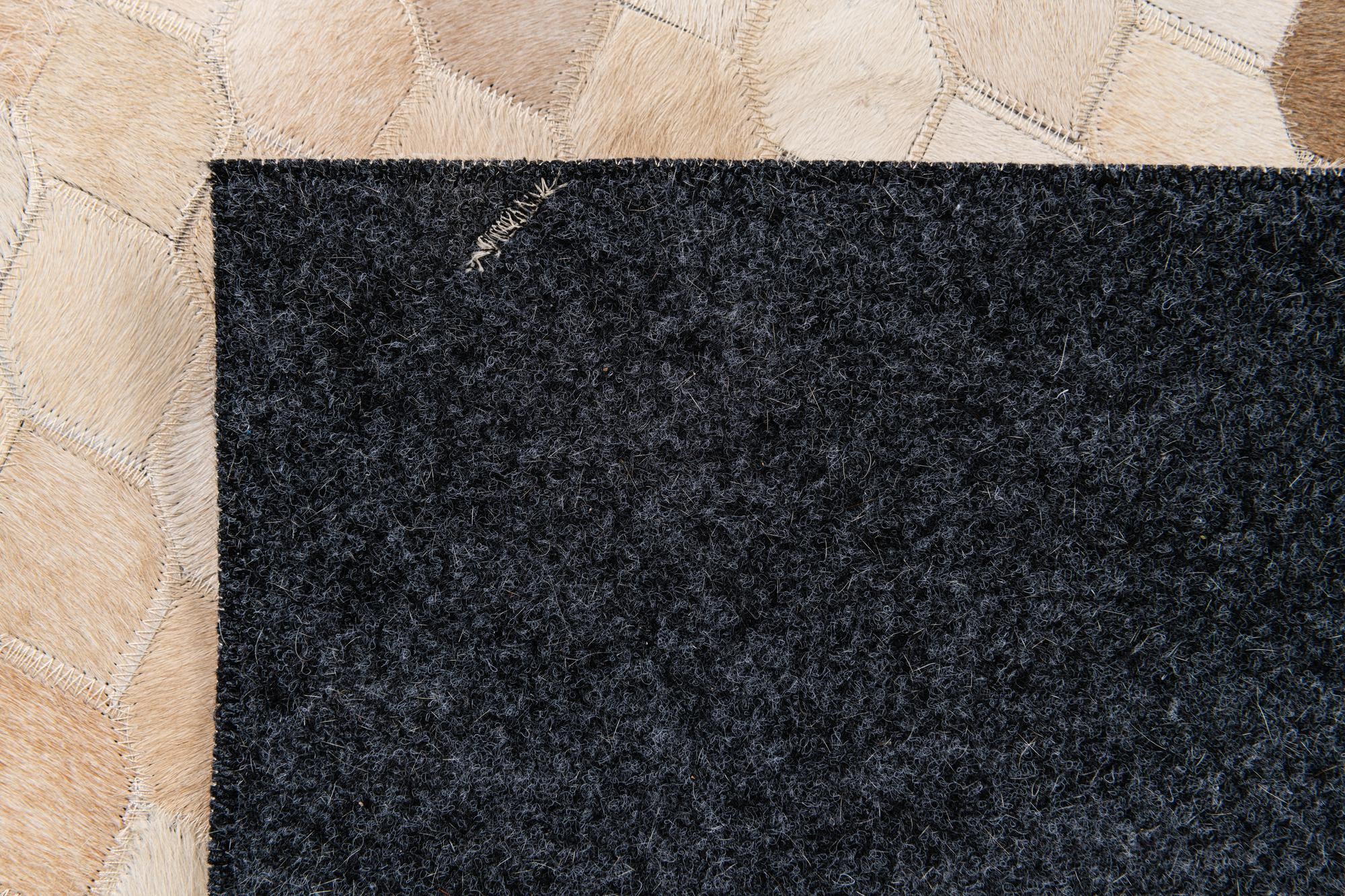 6' 7 x 9' 11 Cowhide Stocks Rug