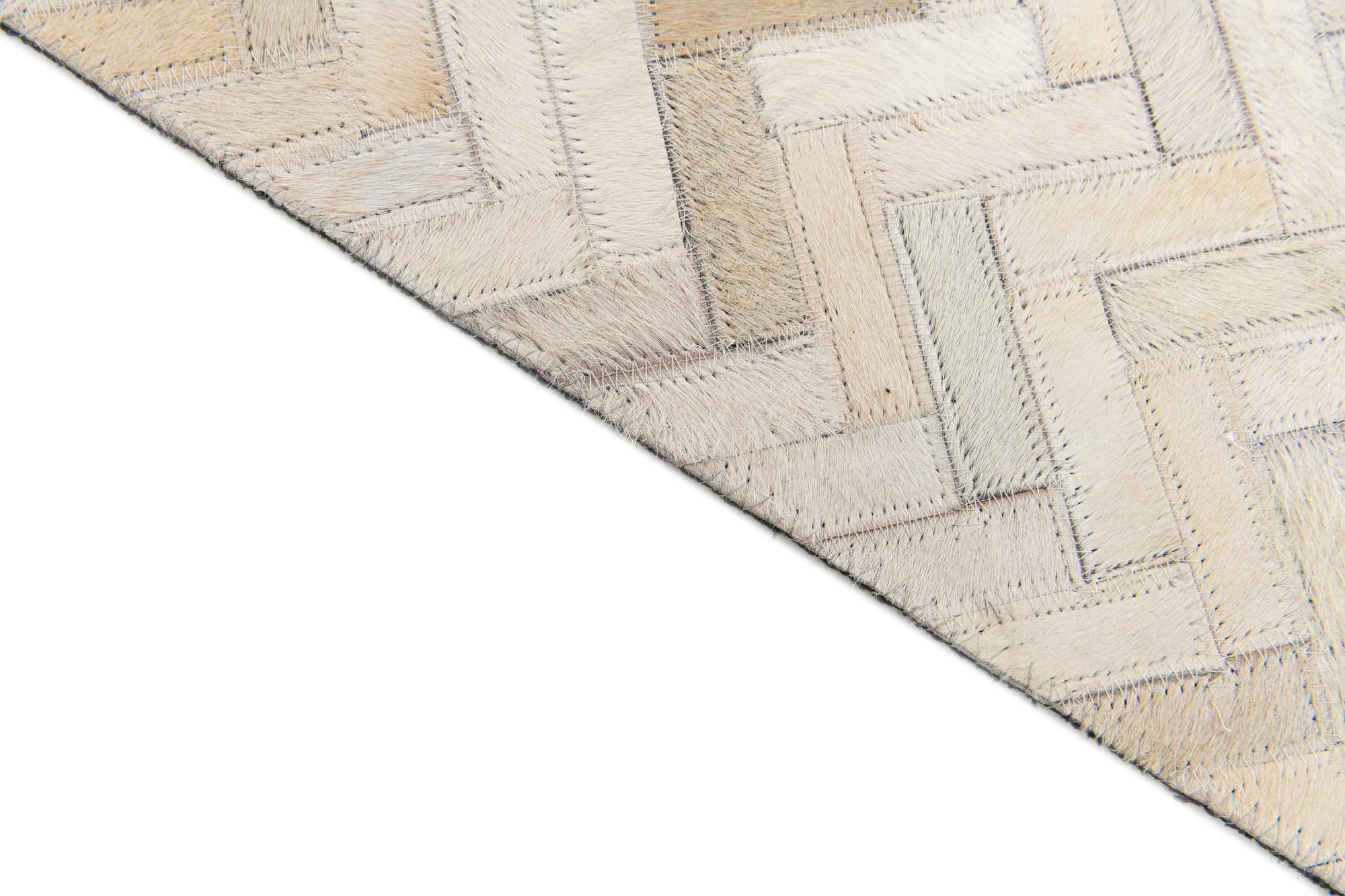 4' 10 x 7' 7 Cowhide Stocks Rug