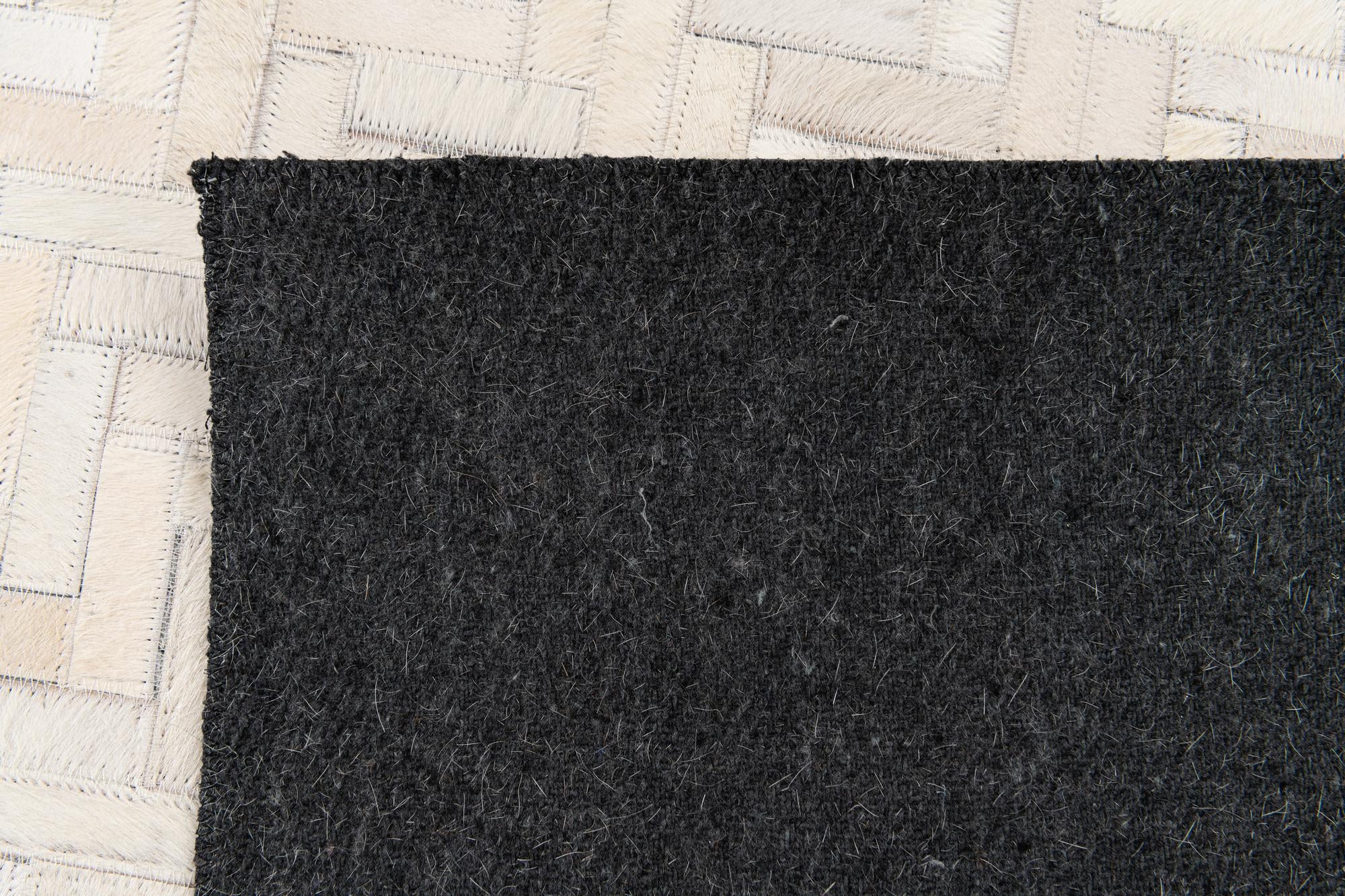4' 10 x 7' 7 Cowhide Stocks Rug