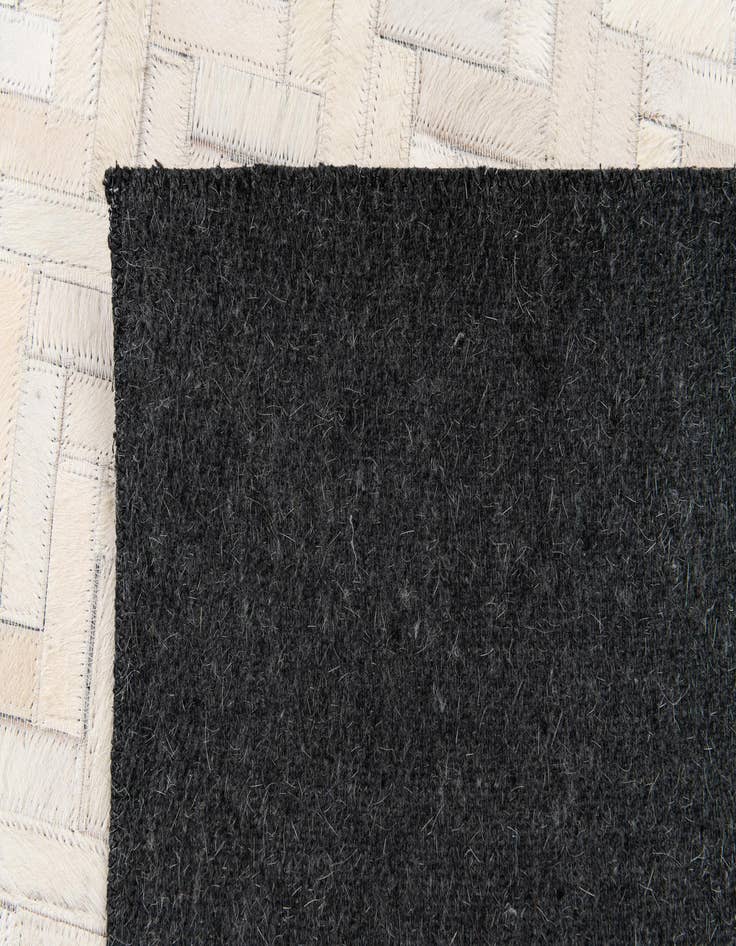 Detail image of 4' 10 x 7' 7 Cowhide Stocks Rug