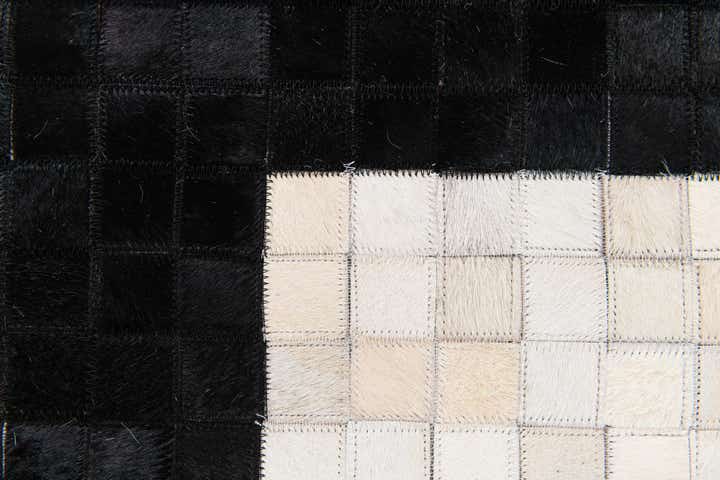 5' 2 x 8' 1 Cowhide Stocks Rug