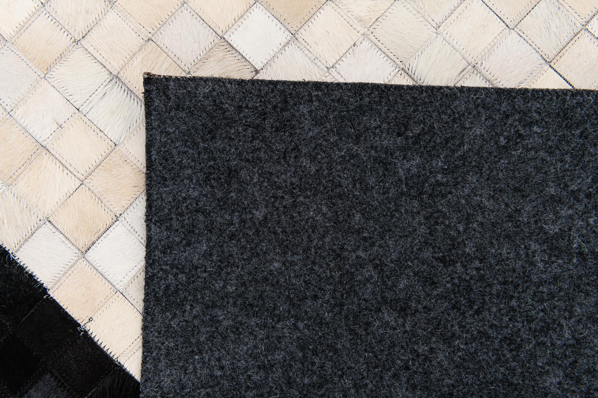 5' 2 x 8' 1 Cowhide Stocks Rug