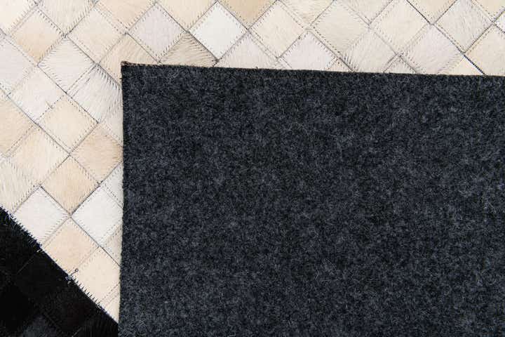 5' 2 x 8' 1 Cowhide Stocks Rug