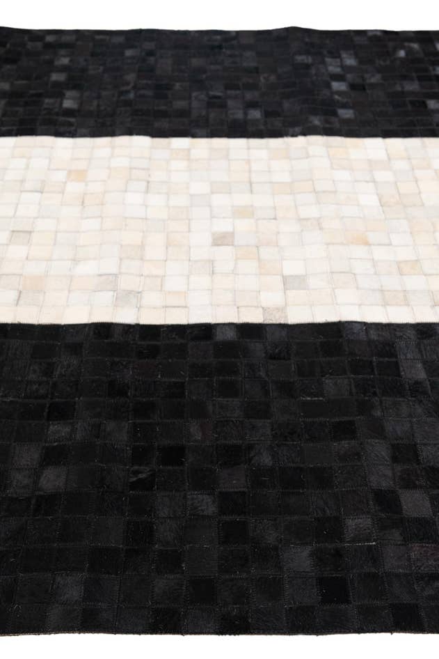 Detail image of 5' x 7' 11 Cowhide Stocks Rug