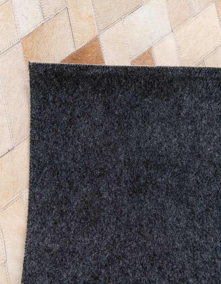 Detail image of 5' x 7' 11 Cowhide Stocks Rug