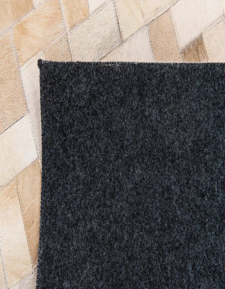 Detail image of 5' x 7' 11 Cowhide Stocks Rug