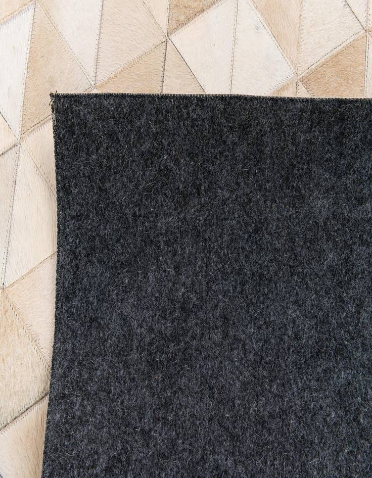 Detail image of 5' 1 x 8' 1 Cowhide Stocks Rug