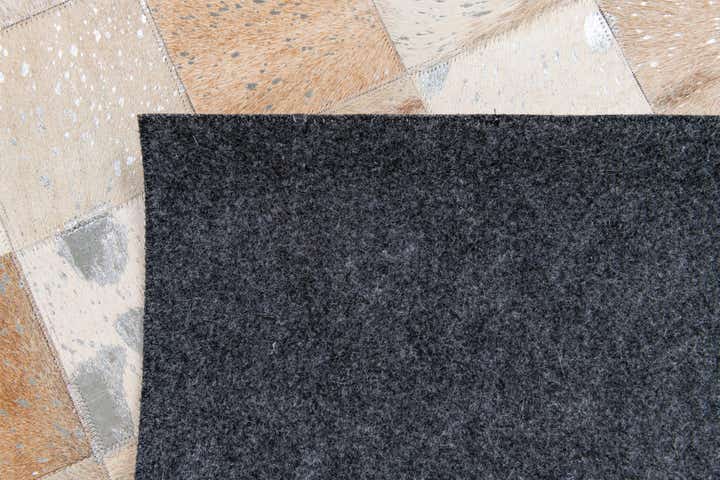 5' 2 x 8' 1 Cowhide Stocks Rug